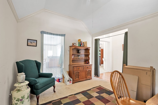 living area featuring lofted ceiling, light carpet, and ornamental molding