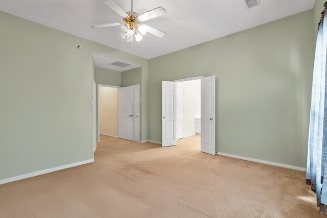 unfurnished bedroom with light carpet, ceiling fan, visible vents, and baseboards