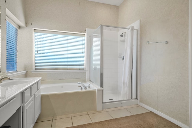 bathroom with vanity, tile patterned flooring, a shower stall, and a bath