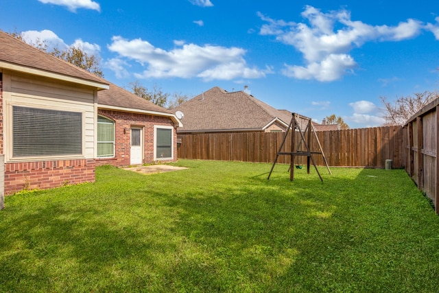 view of yard featuring a fenced backyard