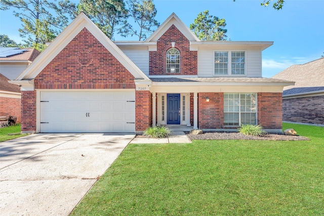 traditional home with a garage, brick siding, driveway, and a front lawn