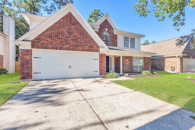 traditional home featuring a garage, driveway, brick siding, and a front lawn