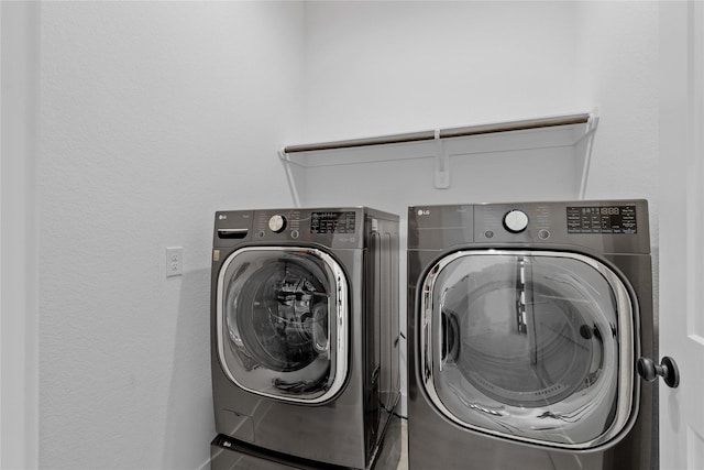 laundry room featuring laundry area and washing machine and clothes dryer