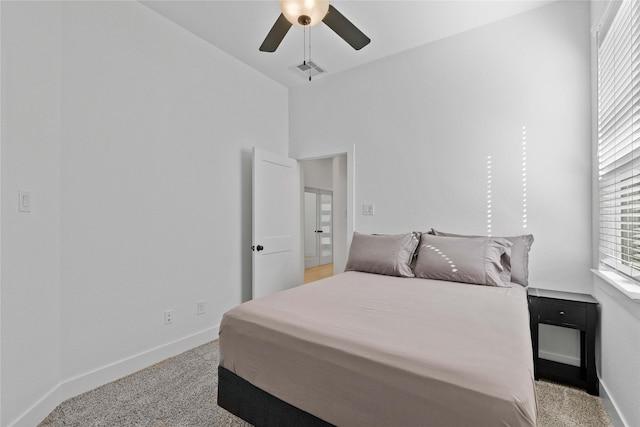 bedroom with carpet, visible vents, ceiling fan, and baseboards