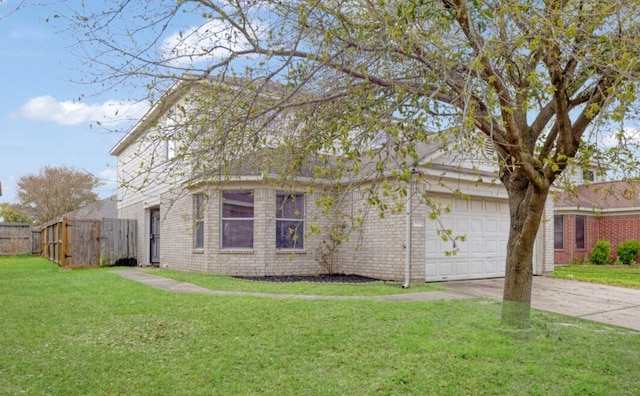 view of side of home featuring a garage, brick siding, a yard, and driveway