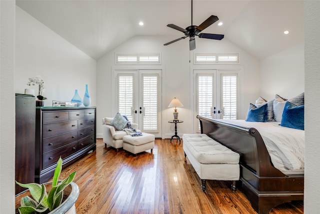 bedroom featuring access to exterior, french doors, vaulted ceiling, ceiling fan, and wood finished floors