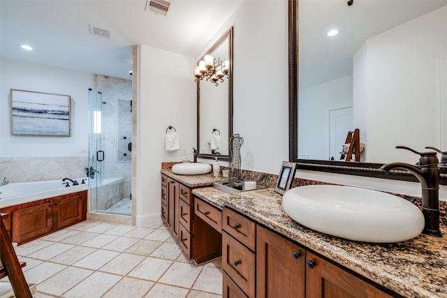 bathroom featuring a stall shower, visible vents, a sink, and a bath