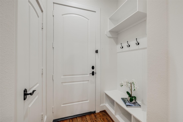 mudroom with dark wood finished floors