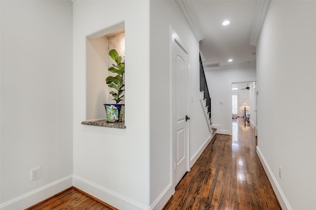 hall with recessed lighting, crown molding, baseboards, and wood finished floors