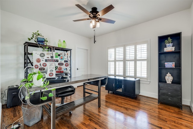 office space with wood finished floors, a ceiling fan, and baseboards