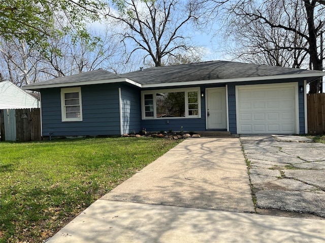 ranch-style house with concrete driveway, a front lawn, an attached garage, and fence