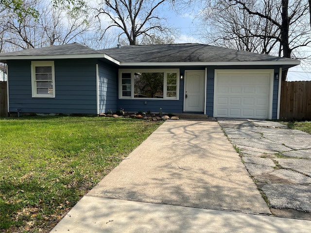 ranch-style home featuring a front lawn, fence, driveway, and an attached garage