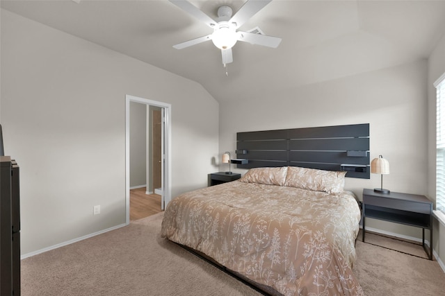 bedroom featuring vaulted ceiling, ceiling fan, carpet flooring, and baseboards