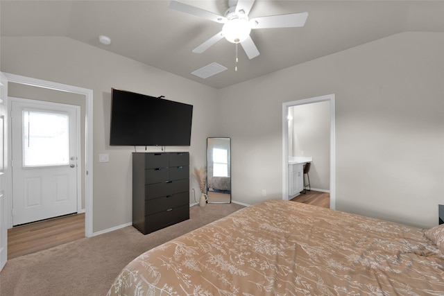 carpeted bedroom with lofted ceiling, multiple windows, ceiling fan, and baseboards