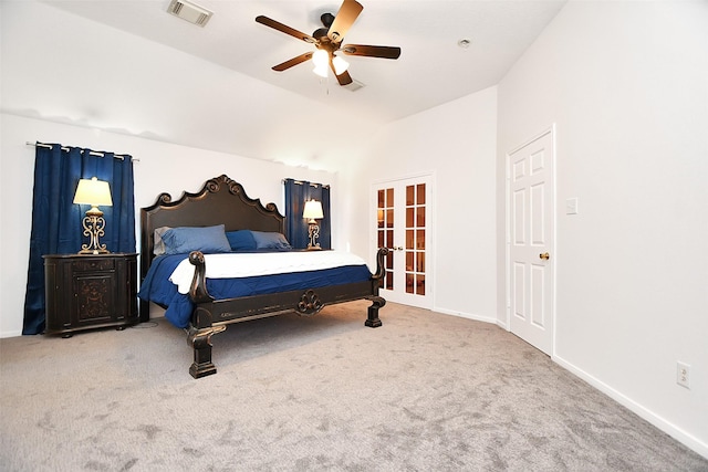 carpeted bedroom with visible vents, french doors, baseboards, and lofted ceiling