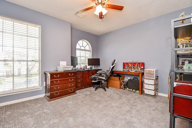 office area featuring visible vents, baseboards, and carpet