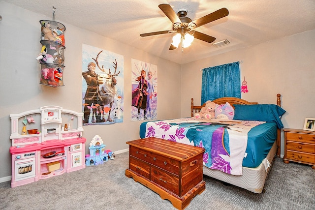 carpeted bedroom with ceiling fan, baseboards, visible vents, and a textured ceiling