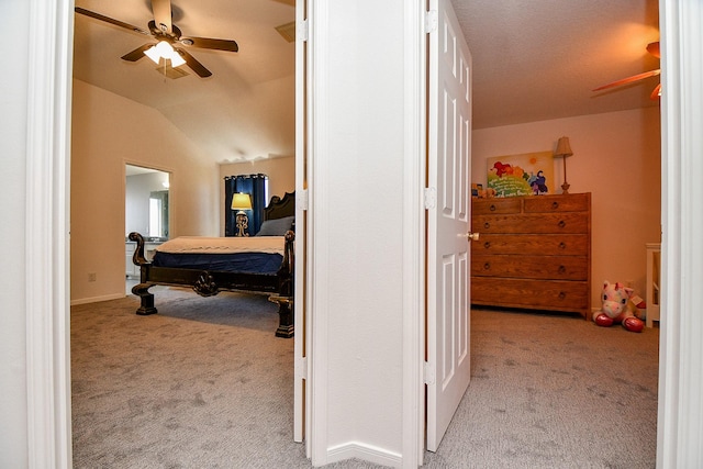 bedroom featuring vaulted ceiling and carpet floors