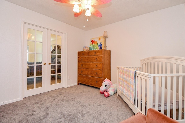 carpeted bedroom with french doors, baseboards, and ceiling fan