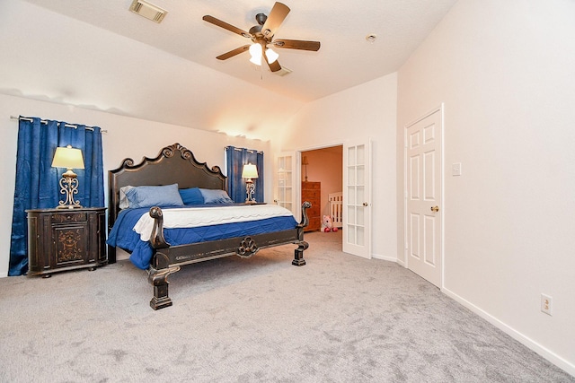 bedroom featuring vaulted ceiling, visible vents, baseboards, and carpet floors