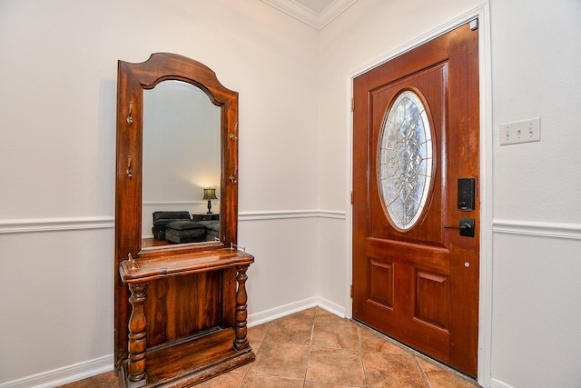 foyer with crown molding and tile patterned floors