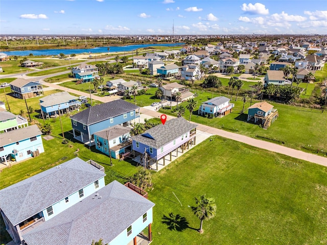 birds eye view of property with a residential view and a water view