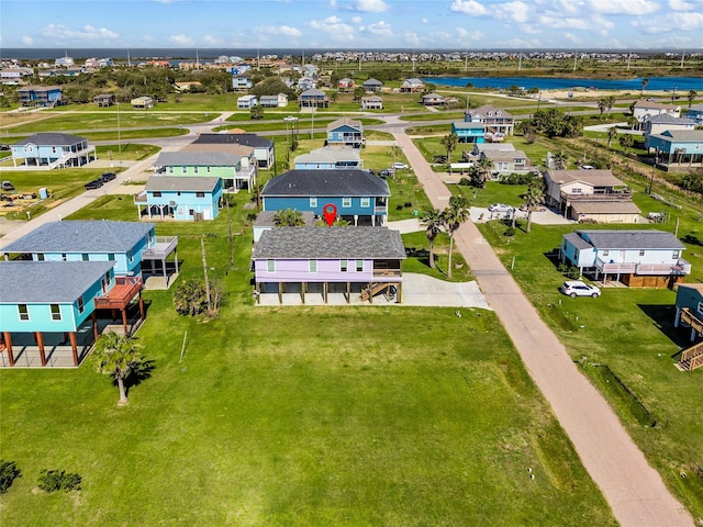 drone / aerial view featuring a water view and a residential view