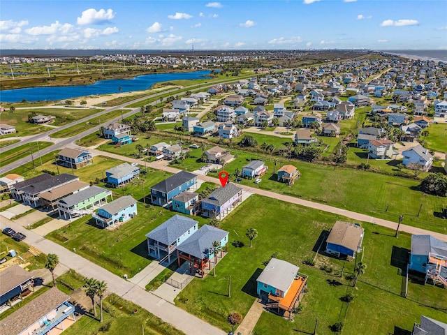 aerial view with a water view and a residential view