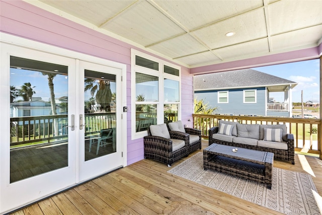 deck with french doors and an outdoor living space