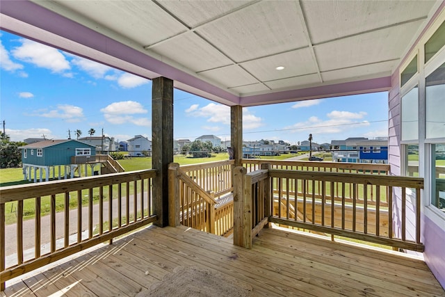 wooden terrace featuring a residential view