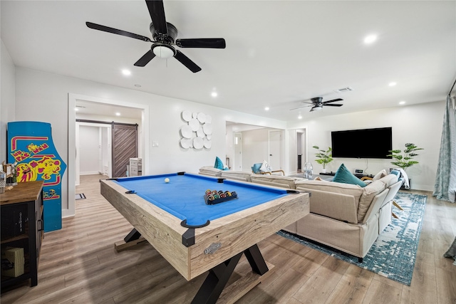 recreation room featuring a barn door, visible vents, wood finished floors, pool table, and recessed lighting