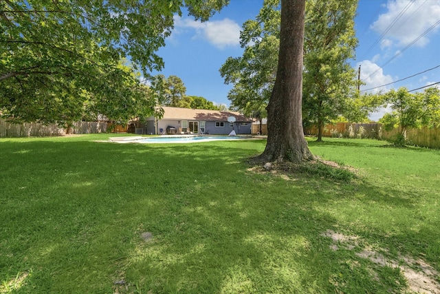 view of yard featuring a fenced backyard and a fenced in pool