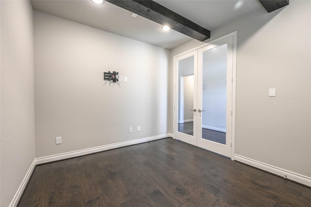 spare room with french doors, dark wood finished floors, recessed lighting, beamed ceiling, and baseboards