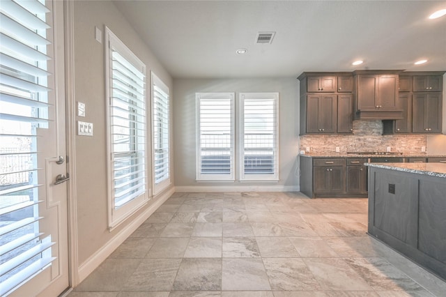 kitchen with recessed lighting, visible vents, baseboards, backsplash, and stainless steel gas stovetop