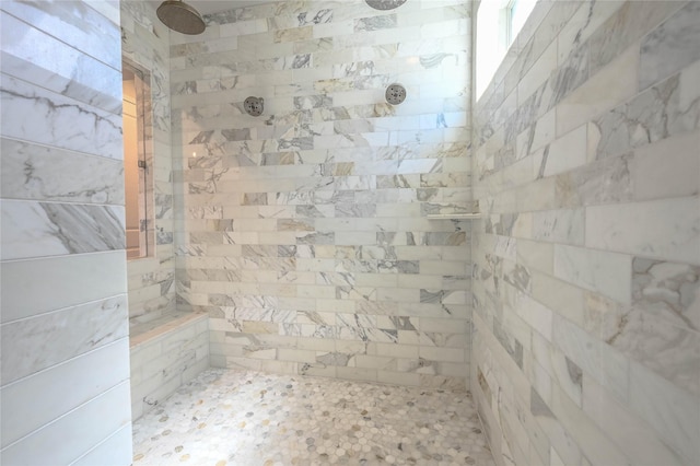 full bath featuring tiled shower