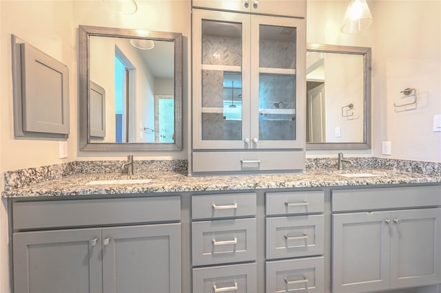 bathroom featuring double vanity and a sink