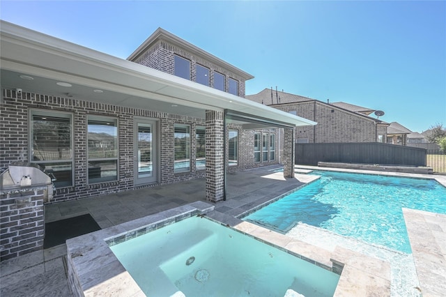 view of pool featuring a patio, fence, a fenced in pool, and an in ground hot tub