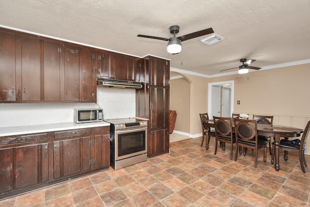 kitchen featuring arched walkways, stainless steel appliances, visible vents, decorative backsplash, and under cabinet range hood