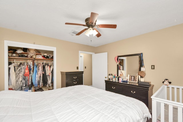 bedroom with a closet, visible vents, and a ceiling fan