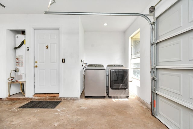 garage with gas water heater and independent washer and dryer