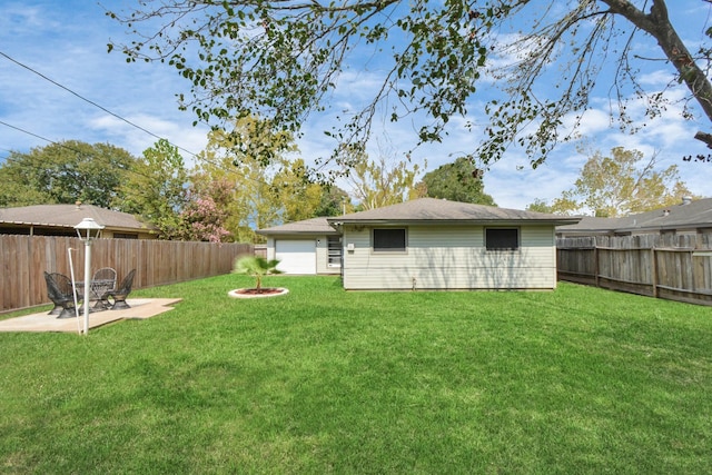 view of yard with a patio area and a fenced backyard