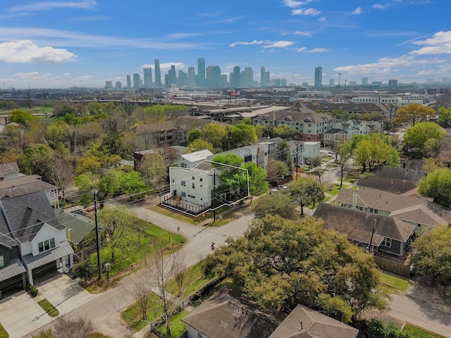 birds eye view of property with a view of city