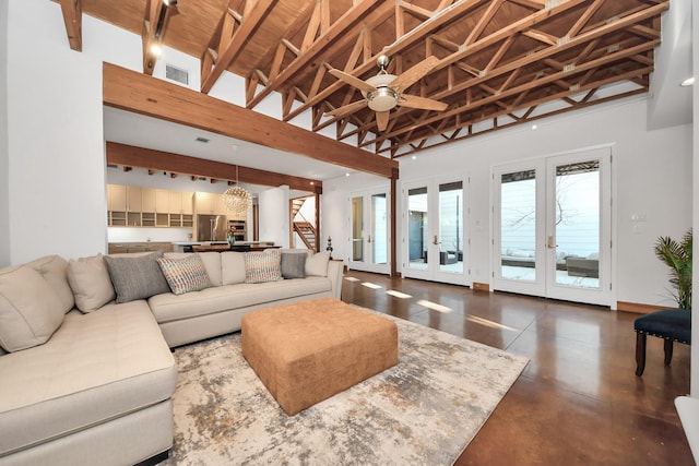 living area with a ceiling fan, visible vents, high vaulted ceiling, finished concrete floors, and french doors