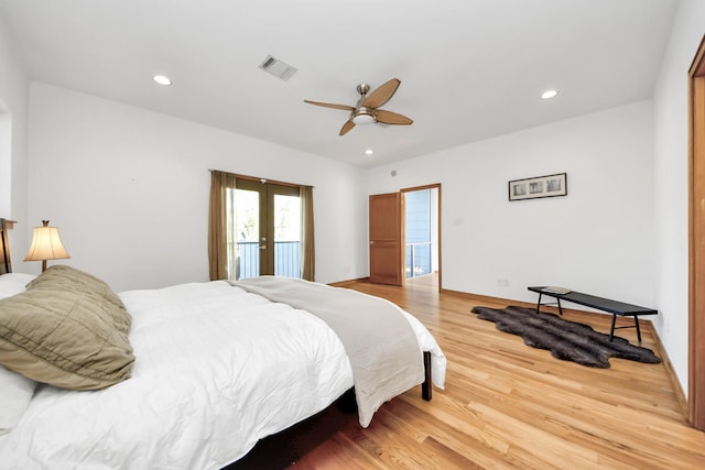 bedroom with recessed lighting, light wood-style floors, visible vents, and french doors