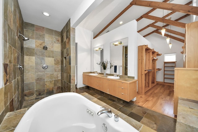 bathroom featuring a tub with jets, double vanity, vaulted ceiling with beams, recessed lighting, and a tile shower