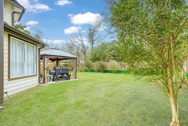 view of yard featuring a gazebo, a patio area, and fence