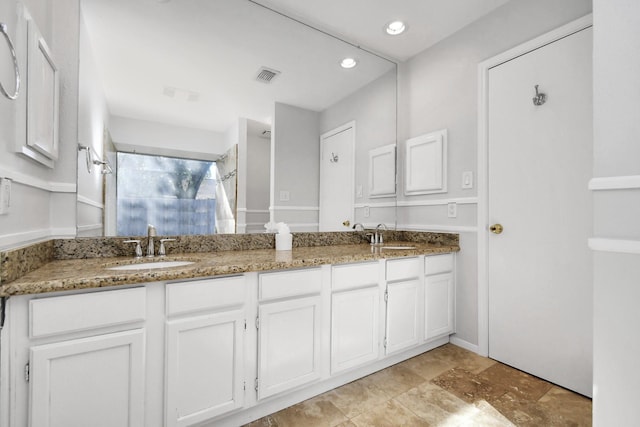 bathroom featuring double vanity, visible vents, a shower, a sink, and recessed lighting