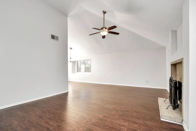 unfurnished living room with a tile fireplace, visible vents, baseboards, a ceiling fan, and dark wood finished floors