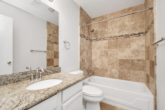 full bathroom with toilet, shower / bath combination, visible vents, and vanity