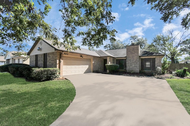 view of front of home featuring driveway, brick siding, a front lawn, and an attached garage